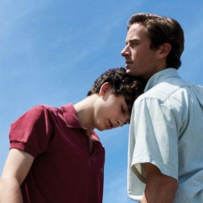 Movie scene where Elio is leaning his head against Oliver's chest.
