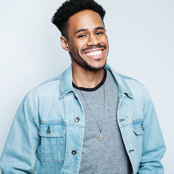 Jay Jurden smiling against a plain background.