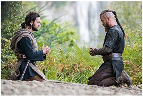 Ragnar and Athelstan, both kneeling and praying in nature with a waterfall behind the.