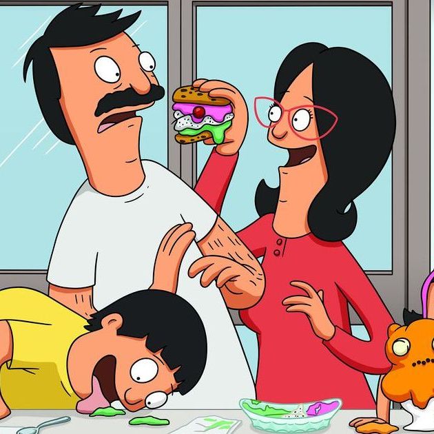 Linda feeding Bob a strange dessert burger while the kids play with the leftover food.