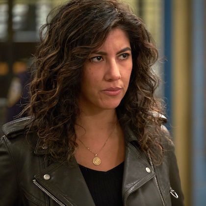Rosa Diaz wearing her classic leather jacket, looks annoyed at someone off camera.