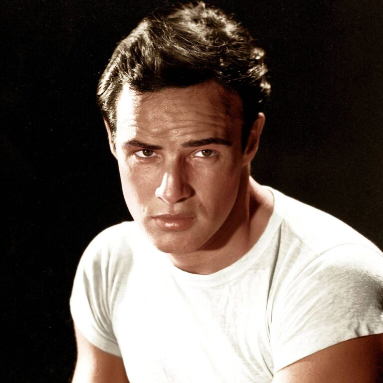 Marlon Brando wearing a plain white t, giving a serious look to the camera.