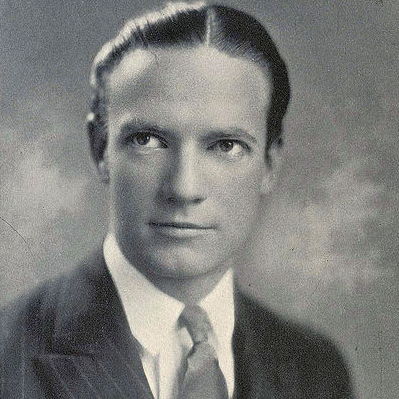 Black and white portrait of Richard Halliburton wearing a suit.