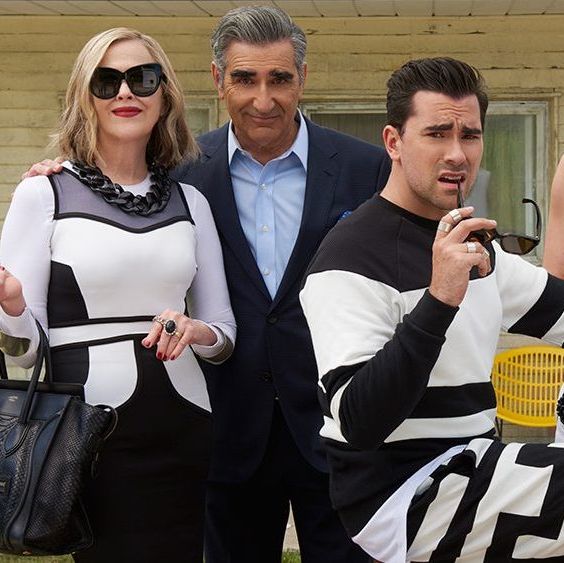 David and his family, all posing for the camera, David is on a bike looking concerned.