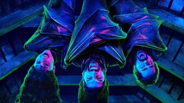 Laszlo and Nadja and the Baron are upside down hanging onto the ceiling wrapped in their wings.