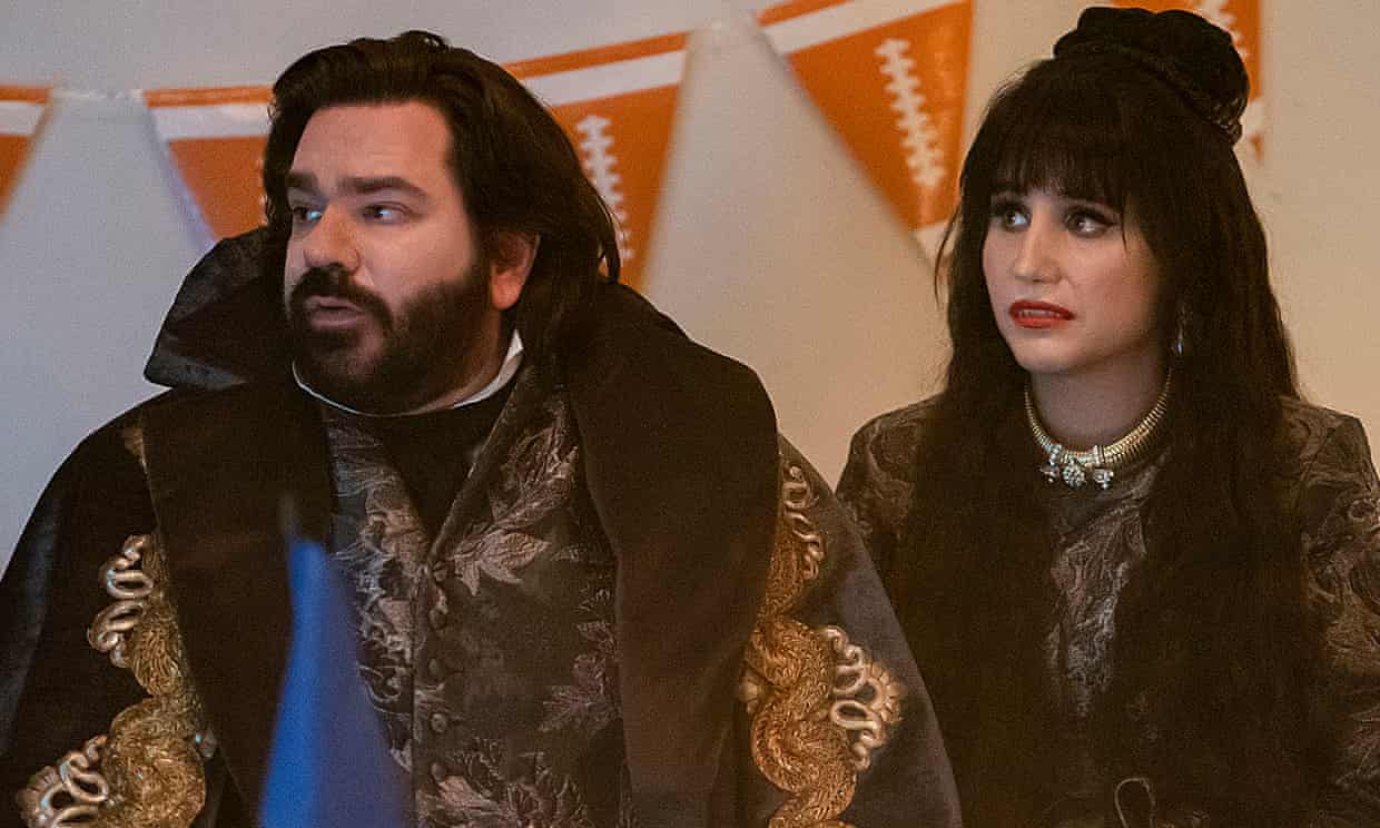 Laszlo and Nadja look at someone out of frame with concern.