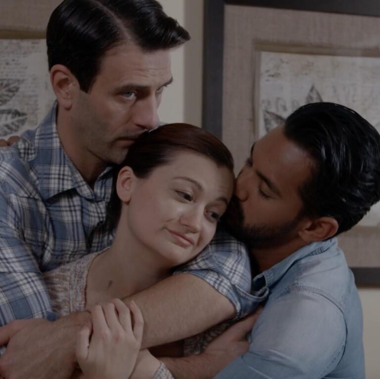 Beau and Caden hold Lily in an embrace inside the living room.