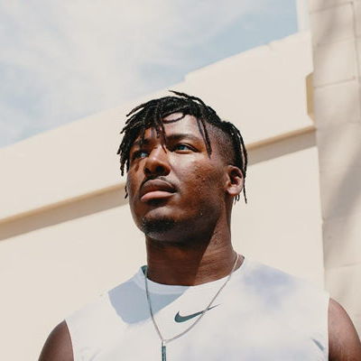 Ryan Russell looking at the distance wearing sports clothes.