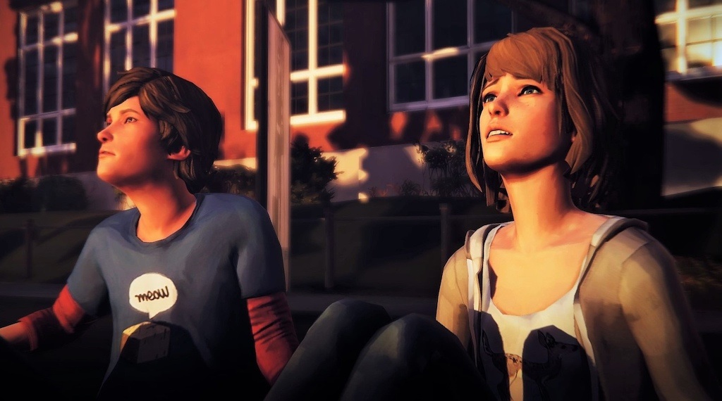 Maxine and Warren sitting side by side looking at the sunset.