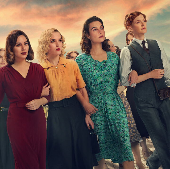Main cast of cable girls walking forward defiantly.