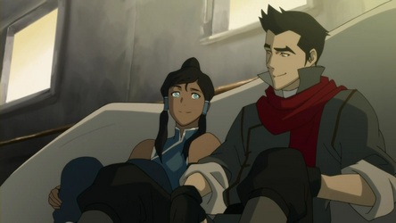 Korra and Mako sitting together smiling having a conversation indoors.
