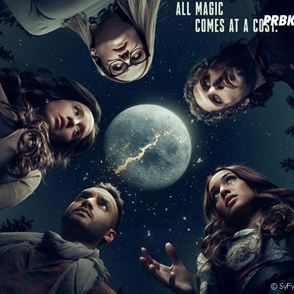 The cast of the magicians looking at eachother while there is a full moon.