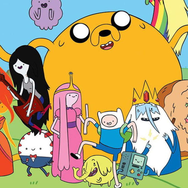The various characters of adventure time posing for a picture in a field.