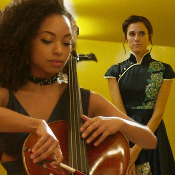 Charlotte watching Lizzine play the cello during one of the concerts.