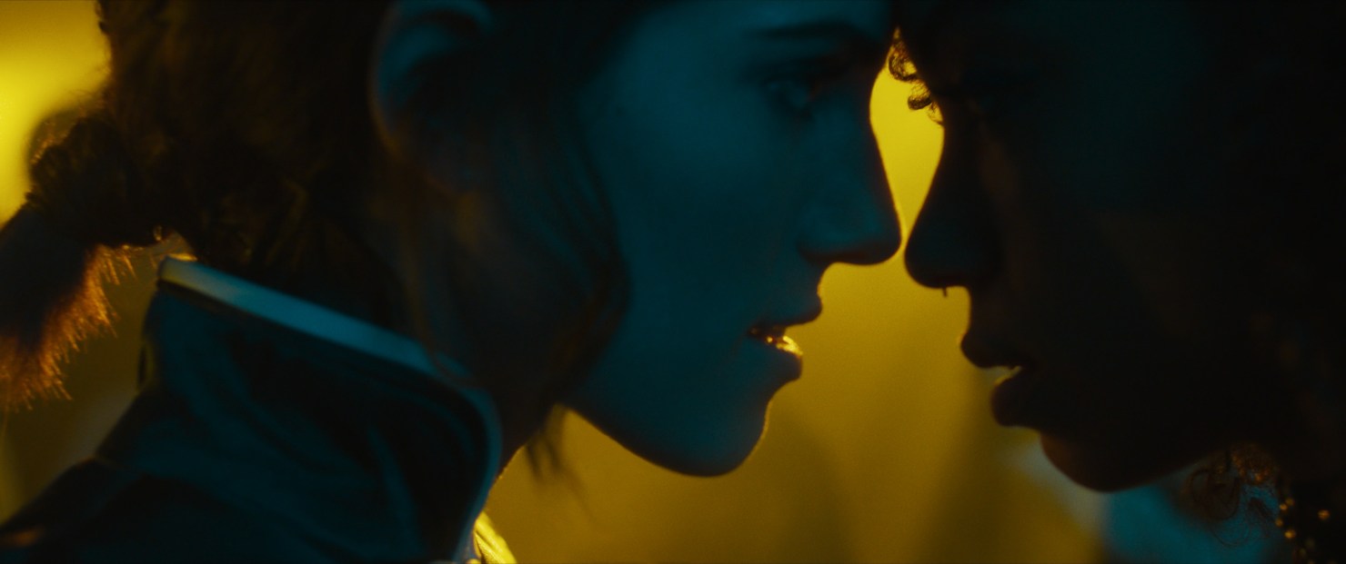 The silhouette of Charlotte and Lizzie getting closer about to kiss after the concert.