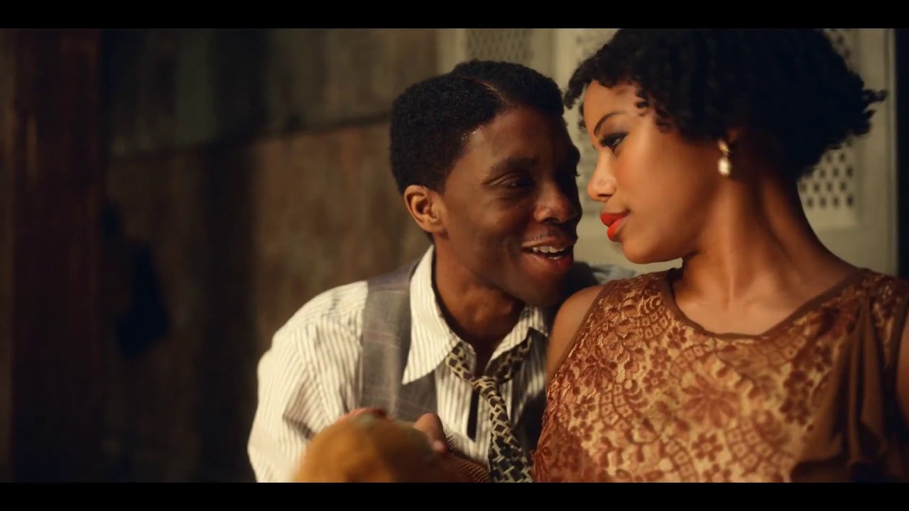 Dussie Mae and Levee talking intimately, next to eachother while Dussie looks ahead.