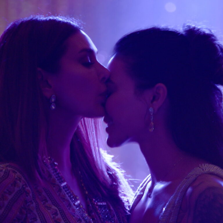 Samara and Umang sharing an intimate moment. Samara is kissing Umang's forehead.