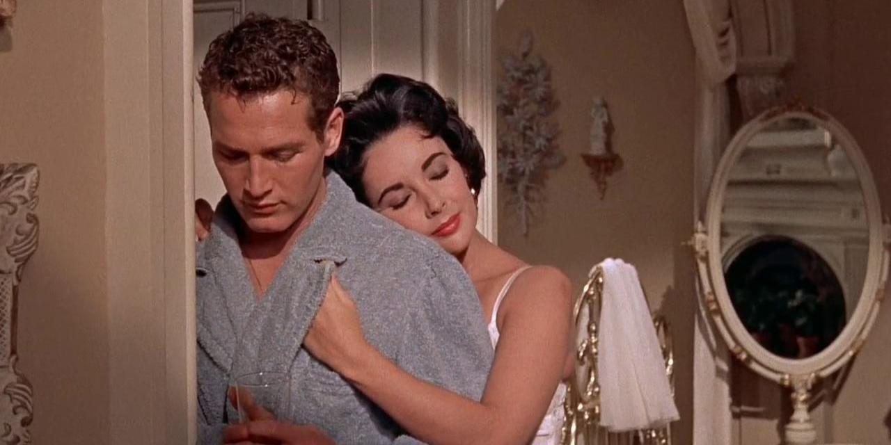 Maggie leaning on Brick's shoulder with her eyes closed, Brick looks down. they are wearing bath robes.