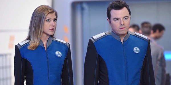 Captain Ed Mercer and his ex wife Kelly Grayson looking worried at someone off camera with their uniforms on.