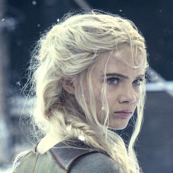Ciri staring down someone off camera while outdoors. It is snowing.