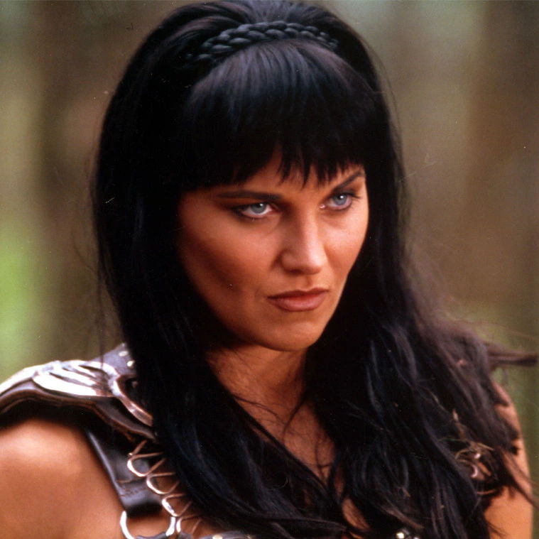 Xena facing an enemy, posing and looking ahead.