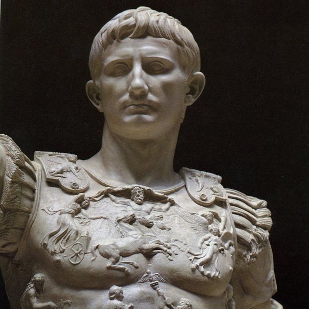 Marble carving of Julius Cesar with a stoic expression.