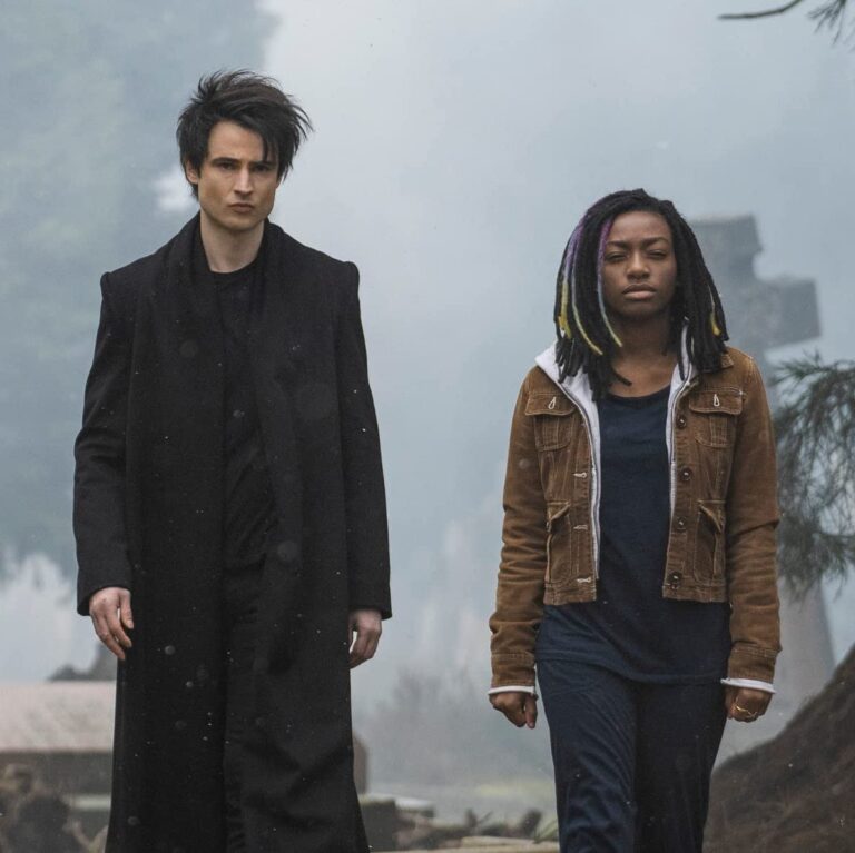 Dream and Rose walking in the cemetery together side by side while it is foggy out.