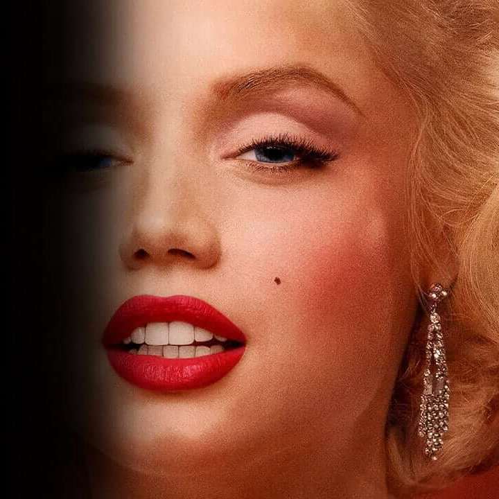 Promo image featuring Marilyn looking into the camera with part of her face covered in shadow.