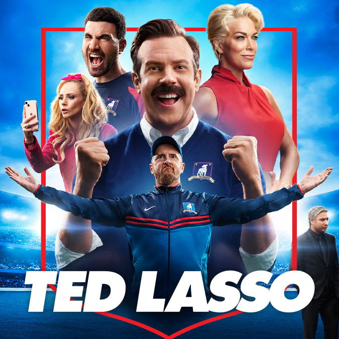 Promotional Image for the show Ted Lasso showing the main cast with Ted Lasso cheering in the center