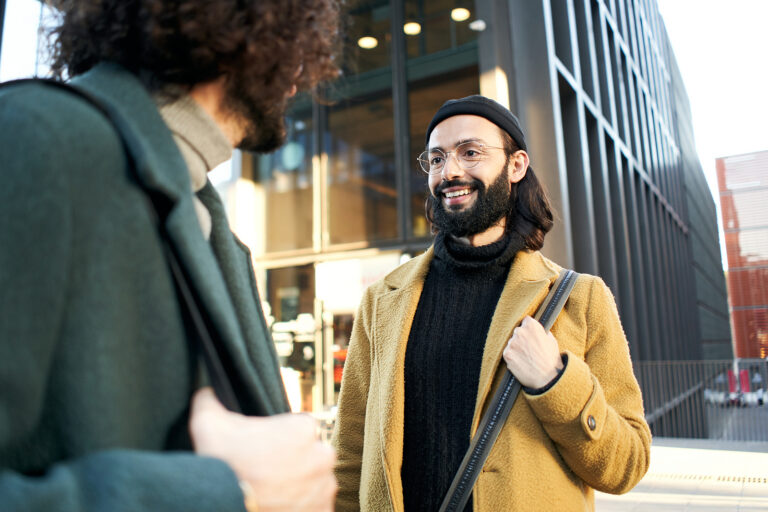 wo gay people meet on the street on their first date after meeting on a dating app.